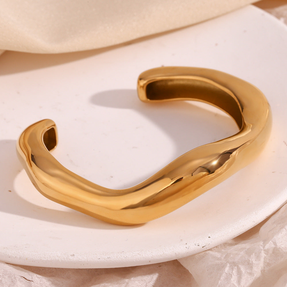 Minimalist and niche temperament, stainless steel plated with 18K exaggerated irregular liquid wave opening bracelet for women