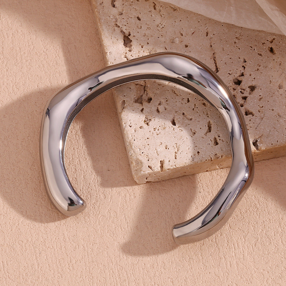 Minimalist and niche temperament, stainless steel plated with 18K exaggerated irregular liquid wave opening bracelet for women